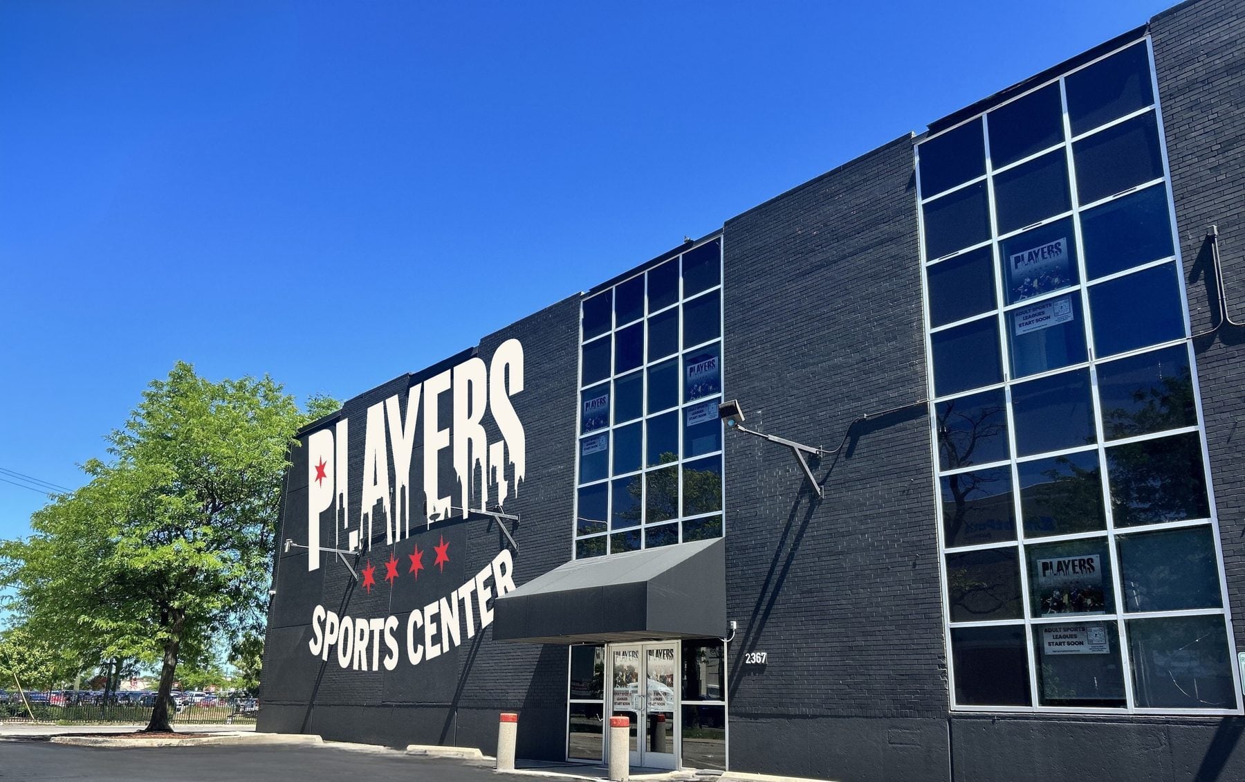 Players Sports Center exterior — dark brick building with PLAYERS logo painted on the side at 2367 W Logan Blvd, Chicago